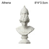 A white plaster bust miniature of a classical Greek figure, used for art practice or home decor.
