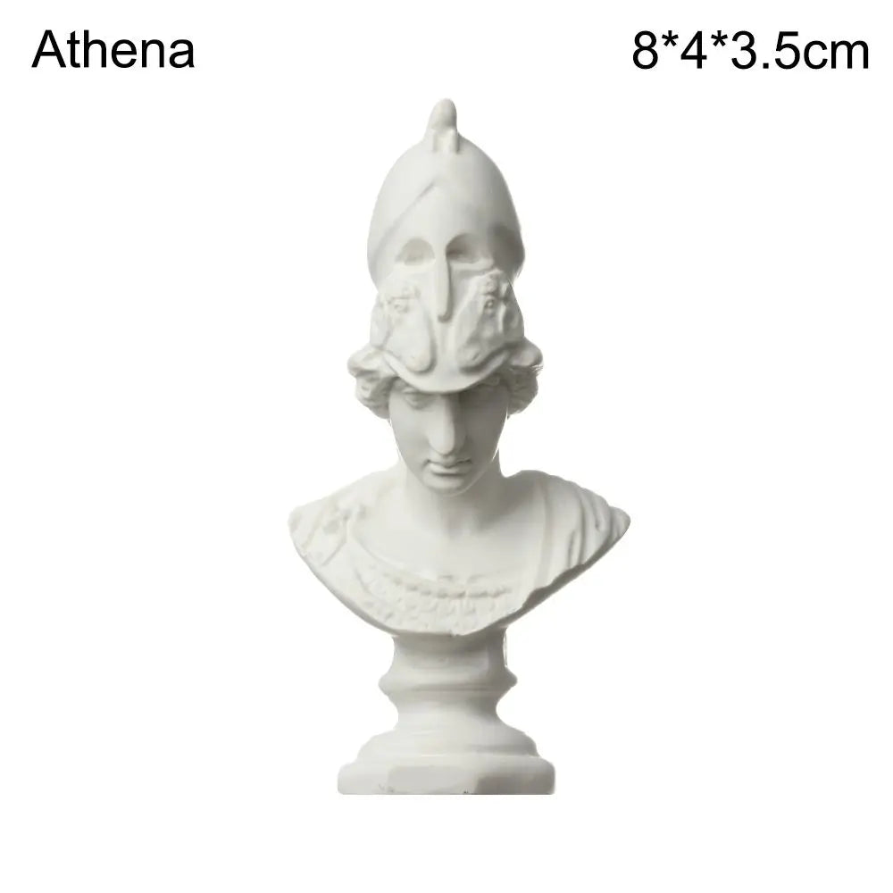A white plaster bust miniature of a classical Greek figure, used for art practice or home decor.