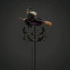 A witch figure in a dark cloak and pointed hat stands atop a rod with a broom, surrounded by black bats.