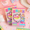 A set of pink and yellow die cut stickers featuring cartoon characters and text on a pink background.