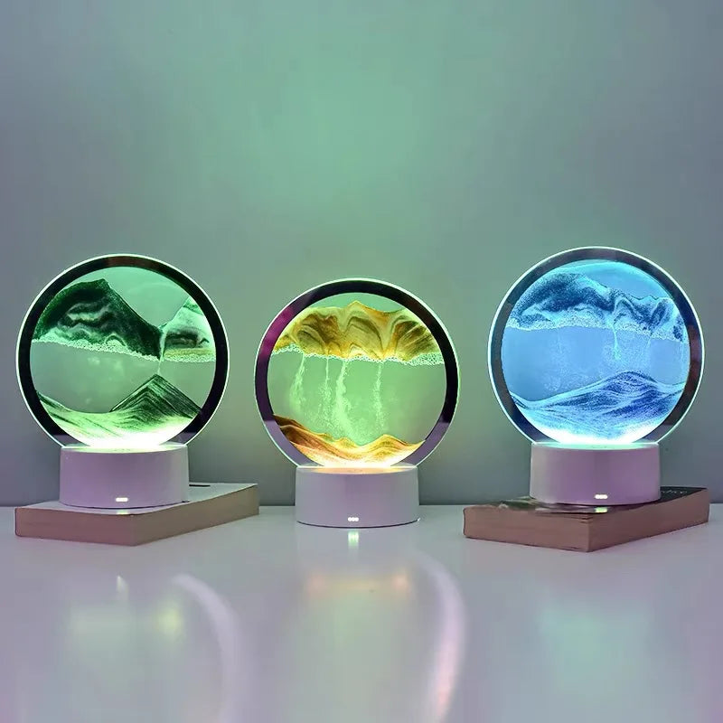 A 3D Quicksand LED table lamp with a color-changing light, featuring three glass spheres displaying different colored liquid 