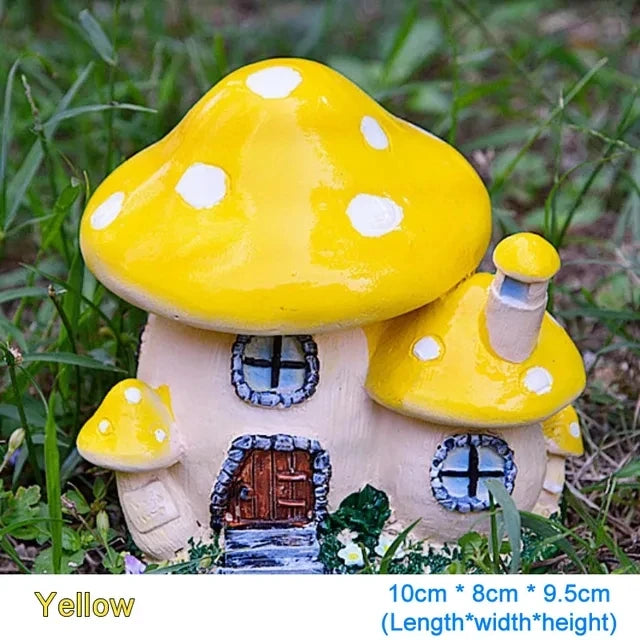 Yellow resin mushroom house garden statue with white polka dots
