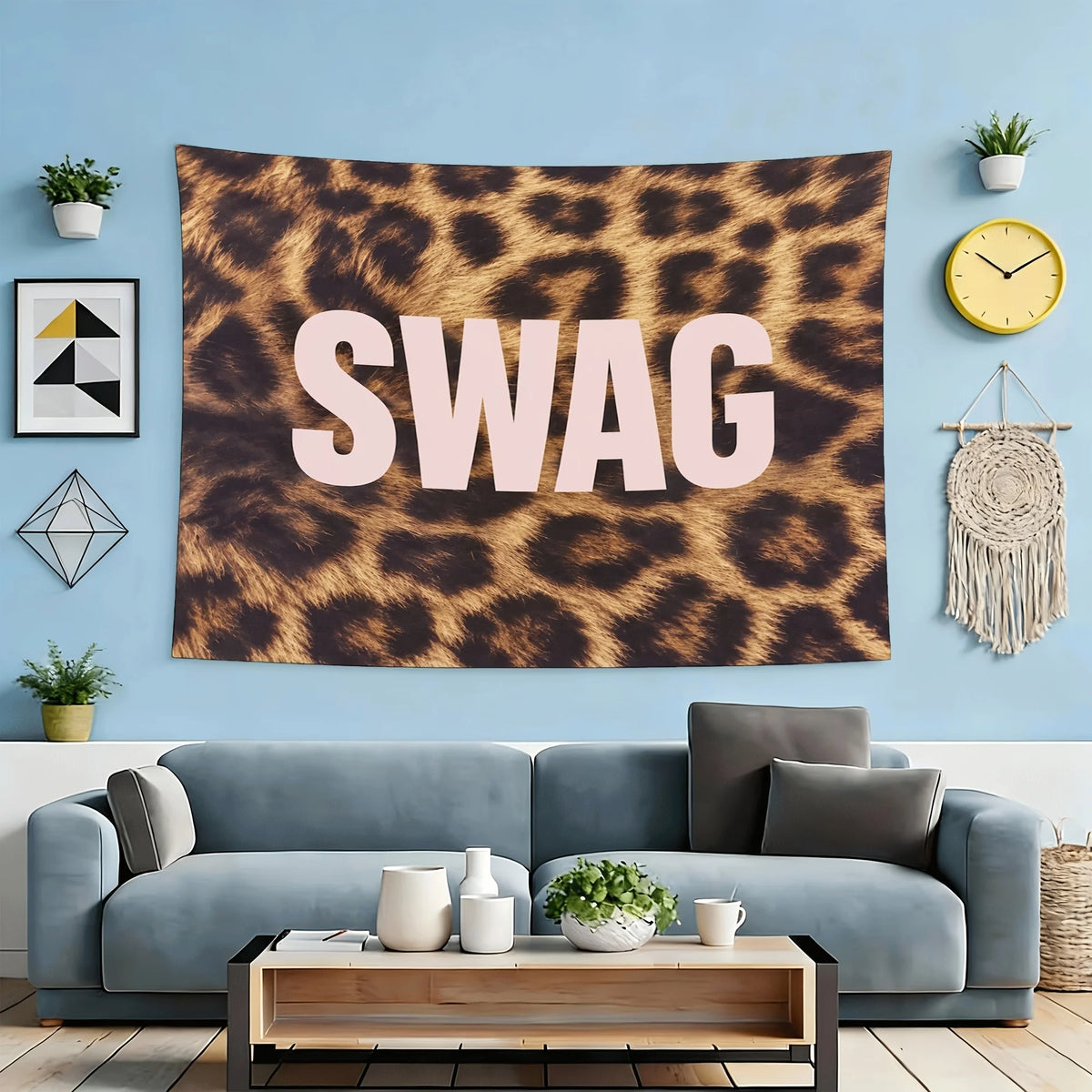 A large brown leopard print tapestry wall hanging featuring the word SWAG in light pink text, displayed above a blue wall.