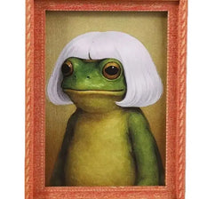 A painting of a green frog in a white frame.