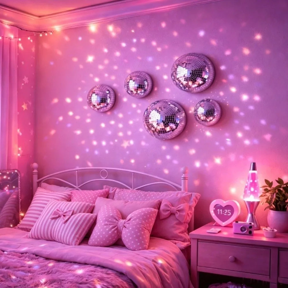 A bedroom decorated with pink lighting and a headboard featuring a set of silver disco ball wall decor