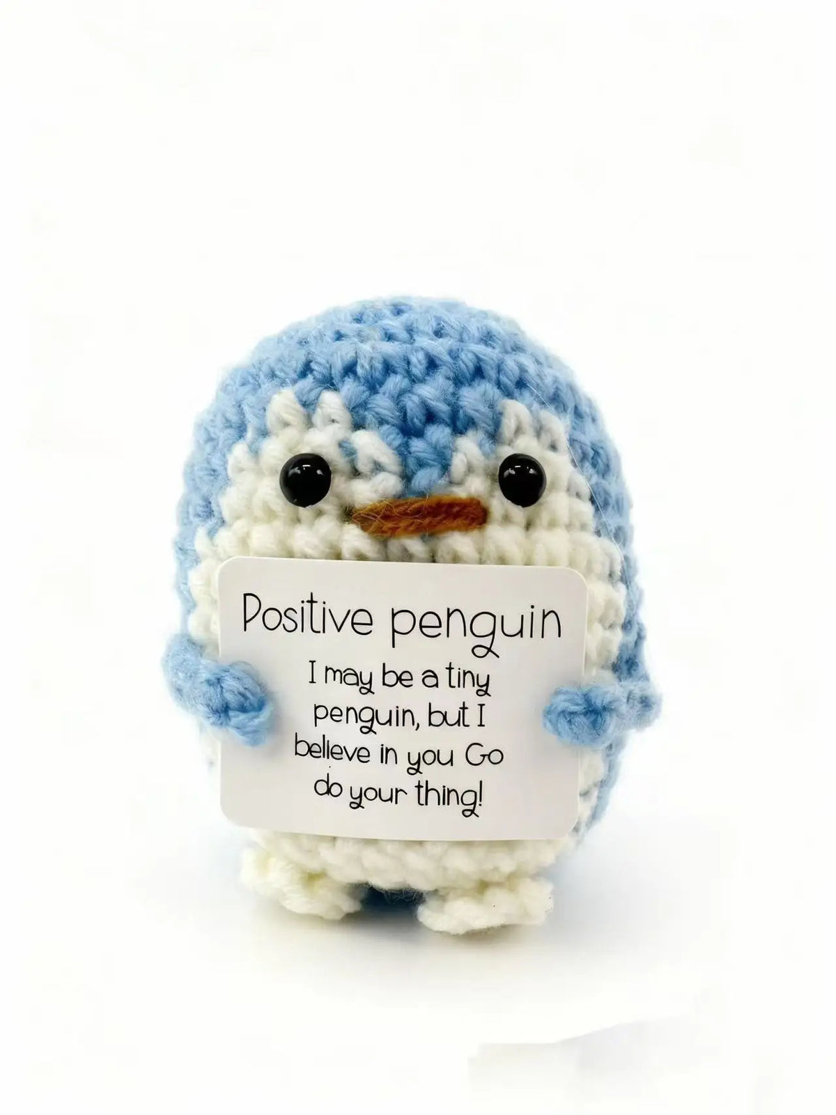 Handmade crochet penguin doll with a positivity card featuring the message I may be a tiny penguin but I believe in you go do