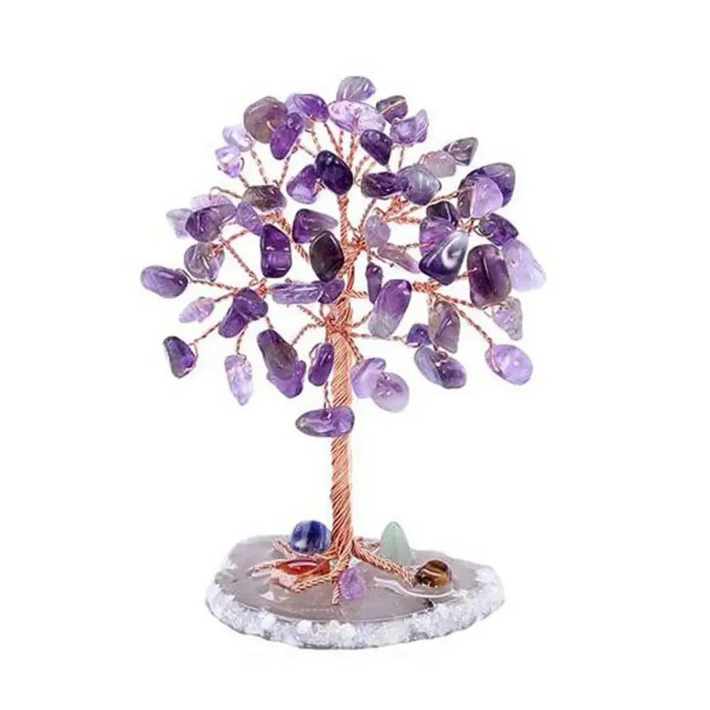 A crystal money tree decor featuring purple amethyst crystals on a wooden branch and a clear base.