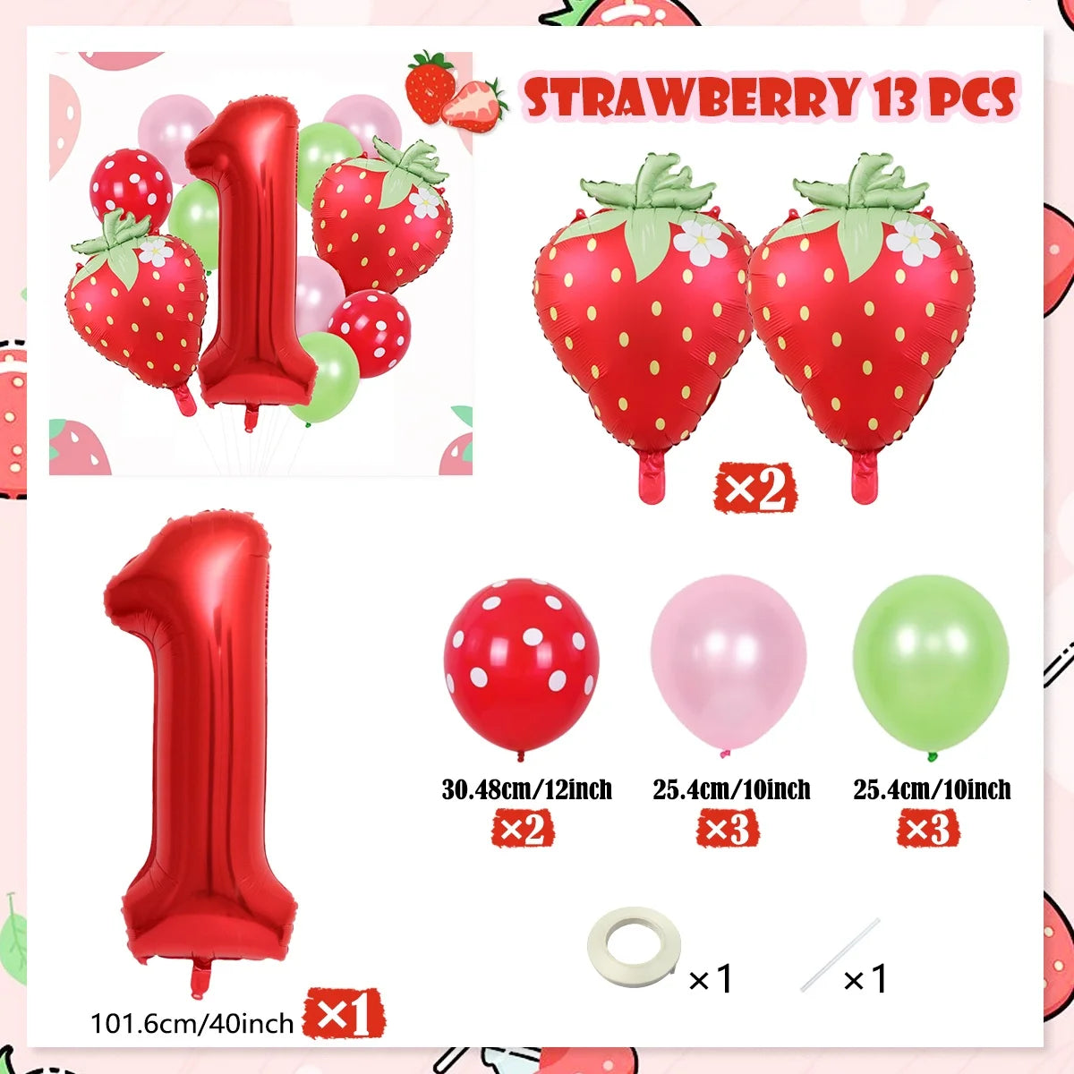 A set of strawberry foil balloons including a number one balloon and various colored balloons.