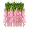 A hanging silk wisteria vine garland featuring pink flowers and green leaves for weddings and home decor.