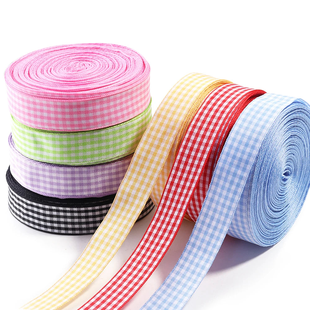 Rolls of colorful gingham ribbon in pink, lime green, purple, and red patterns for gift wrapping and decor