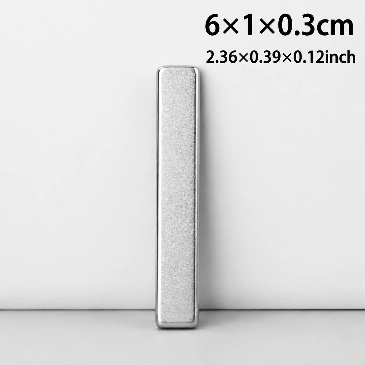 Silver rectangular magnet with dimensions 2.36x0.39x0.12 inches