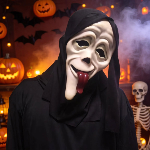 A person wearing a white horror mask with a protruding red tongue and a black cloak, set against a background of carved pumpk