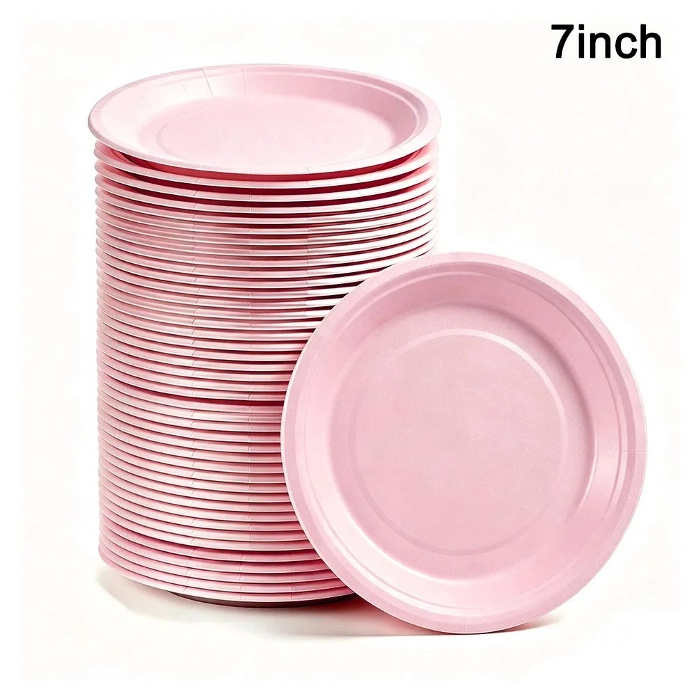 A stack of pink 7-inch disposable paper plates is shown next to a single plate.