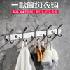 A set of six polished stainless steel wall-mounted hooks is displayed against a gray concrete background.