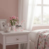 Elegant pink acrylic butterfly plaque displayed on a white bedside table.