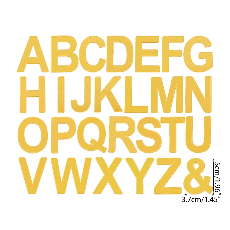 A set of yellow acrylic alphabet letters A through Z and an ampersand for a cake topper