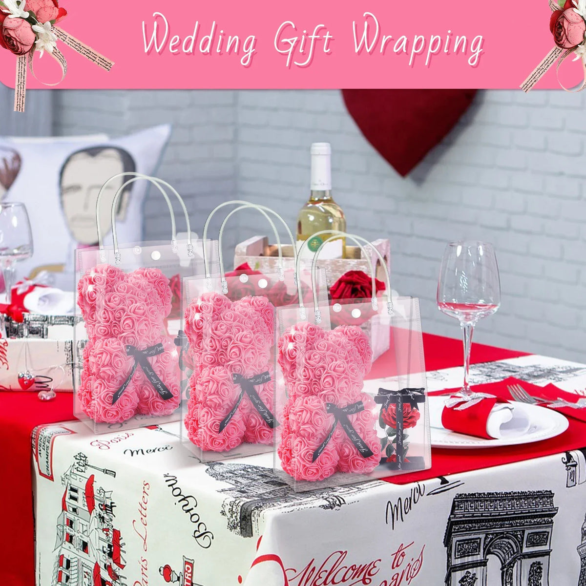 Clear reusable PVC gift bags with pink floral designs displayed on a table setting.