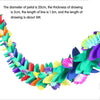 A colorful floral arrangement of green, purple, and pink fabric petals.