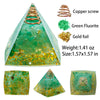A green crystal pyramid made of fluorite and gold foil with a copper screw top.