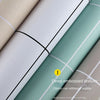 Close-up of a roll of matte, deep embossed texture kitchen wall sticker in sage green and beige tones.