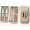 An open leather case displaying an 8-piece stainless steel manicure and pedicure kit with various tools.