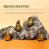 Brass crafted hedgehog statue resting on a rock, used as an exquisite ornament for home decor.