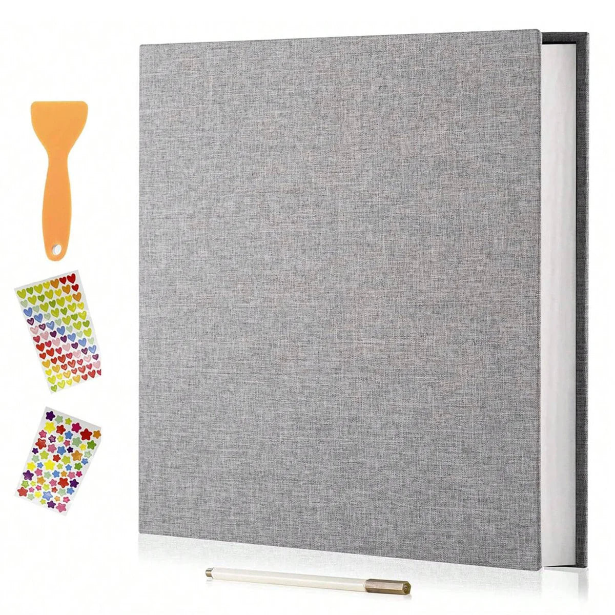 A grey linen scrapbook photo album with a wooden tool and colorful adhesive stickers displayed on a white surface.