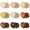 A collection of latex balloons in various neutral shades, including beige, cream, and brown, displayed next to dried natural 