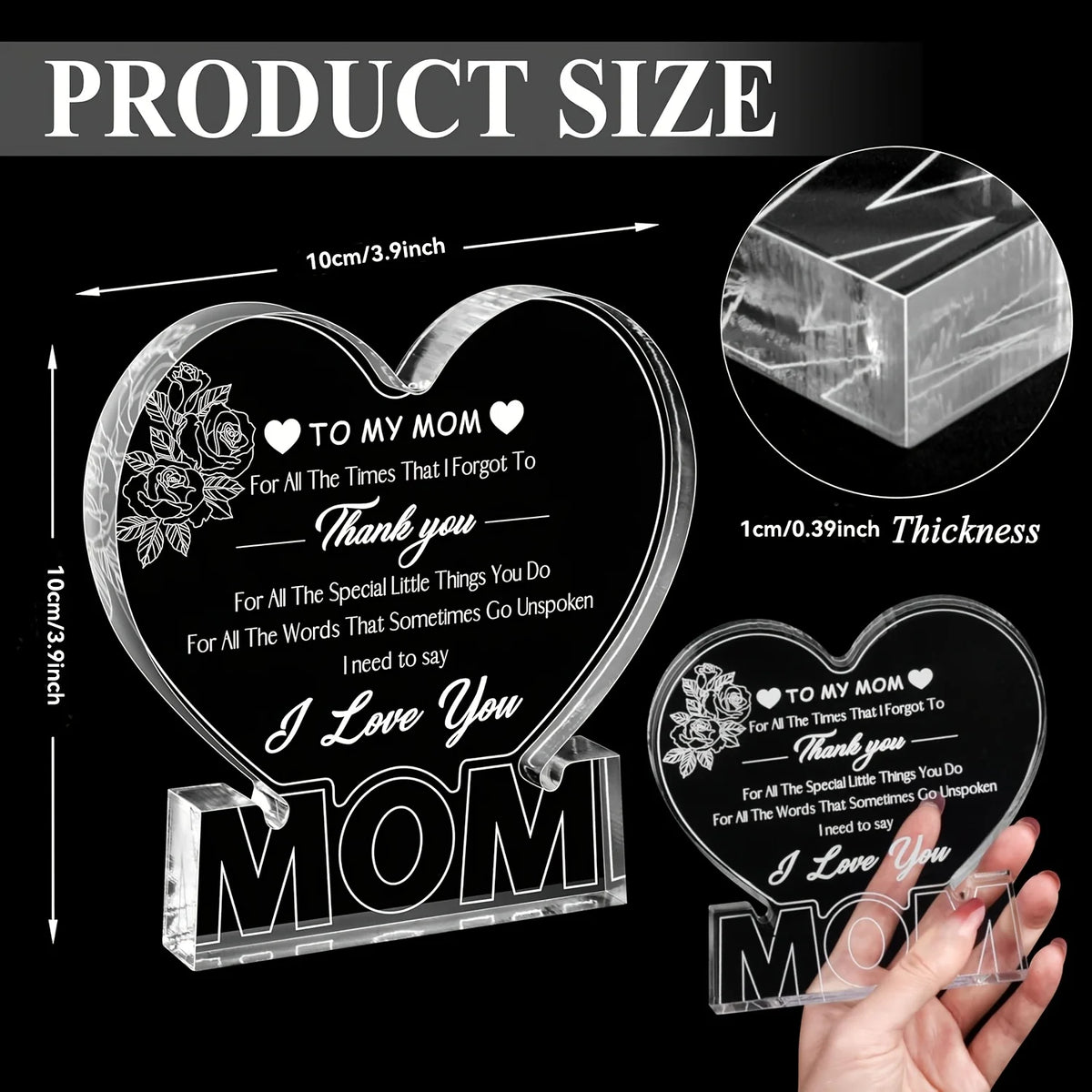 A clear acrylic heart plaque engraved with 'I Love You Mom' and floral designs, shown next to a hand for scale.