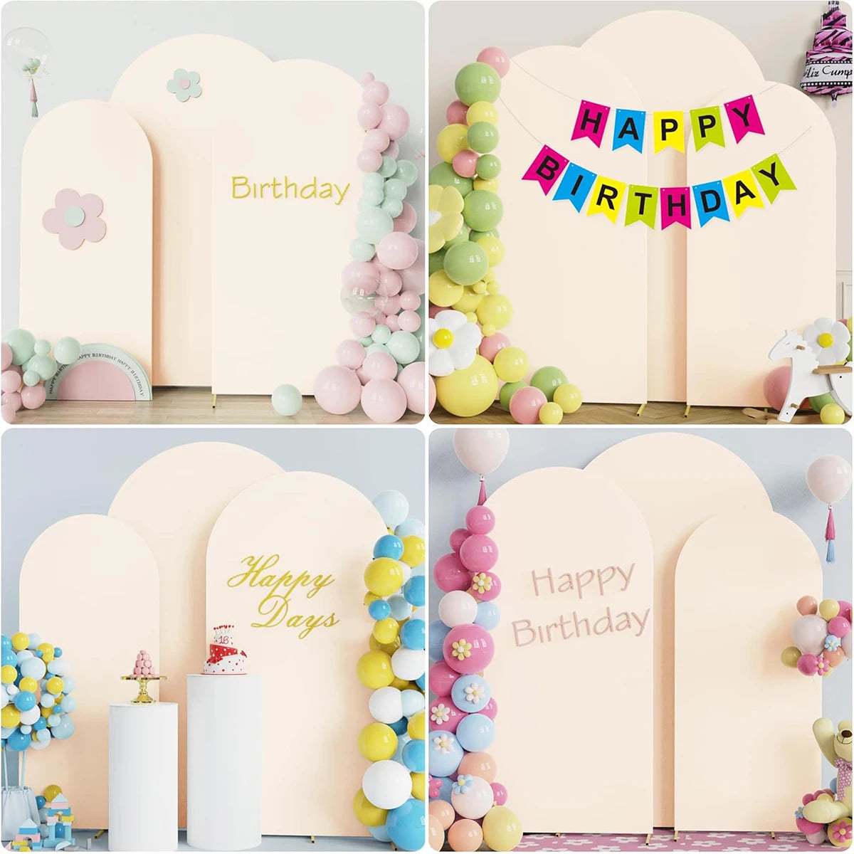 A set of light pink and yellow arch stand backdrops decorated with balloons and banners for birthday or wedding events