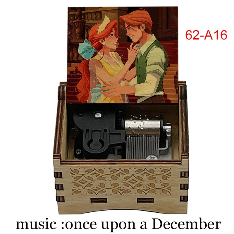 A hand-cranked wooden music box featuring two animated characters, one with red hair and the other with auburn hair.