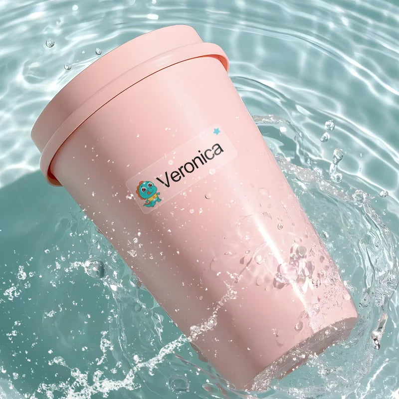 A pink tumbler with the name Veronica sticker floating in clear water.
