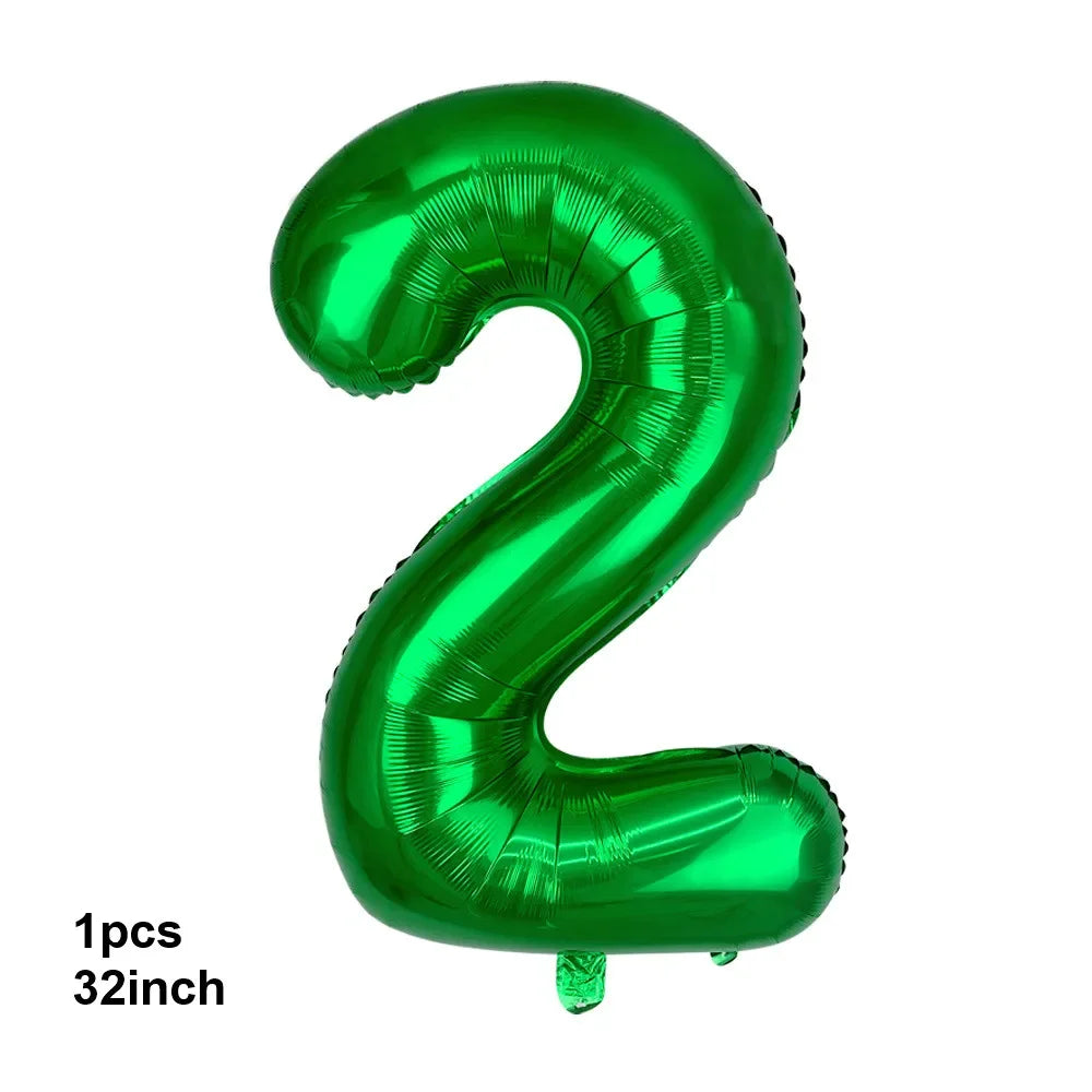 A shiny green latex balloon shaped like the number 2.