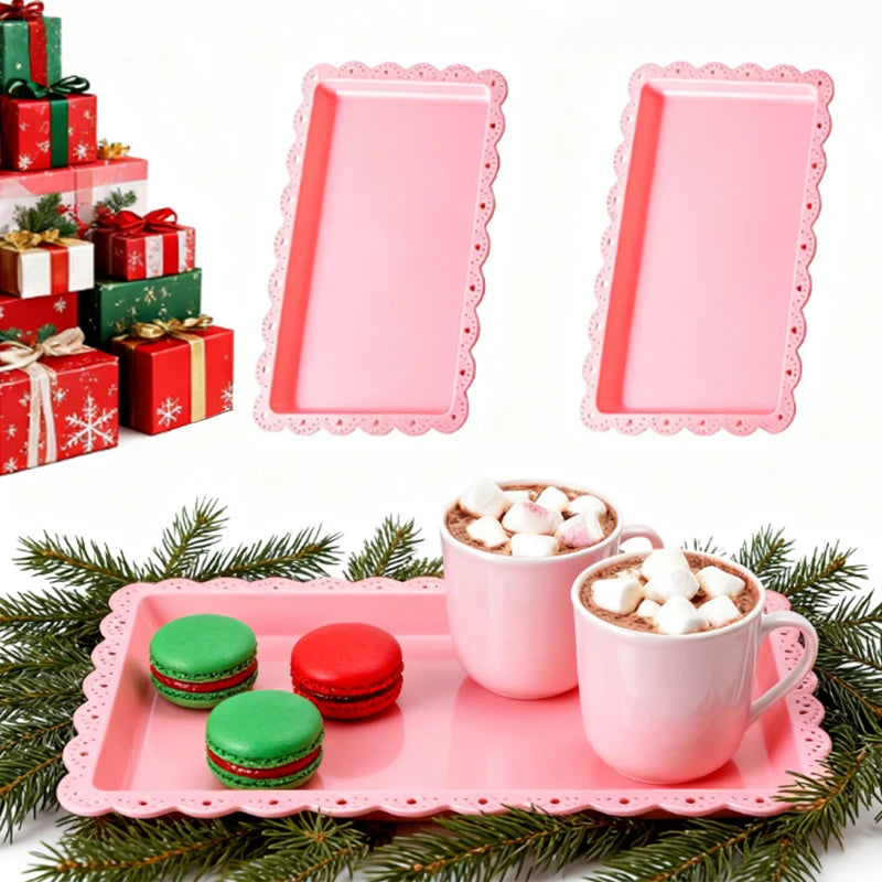 Pink three-tier dessert rack with rectangular trays and a pink teacup filled with whipped cream