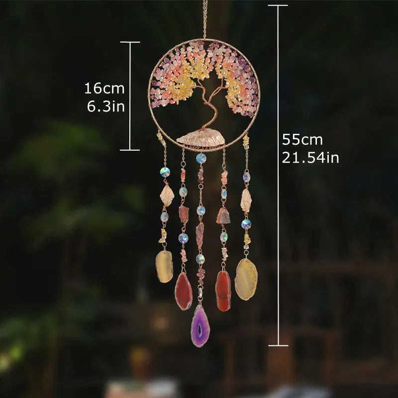 A hanging crystal tree of life sun catcher featuring pink and yellow crystals with multiple dangling beads.