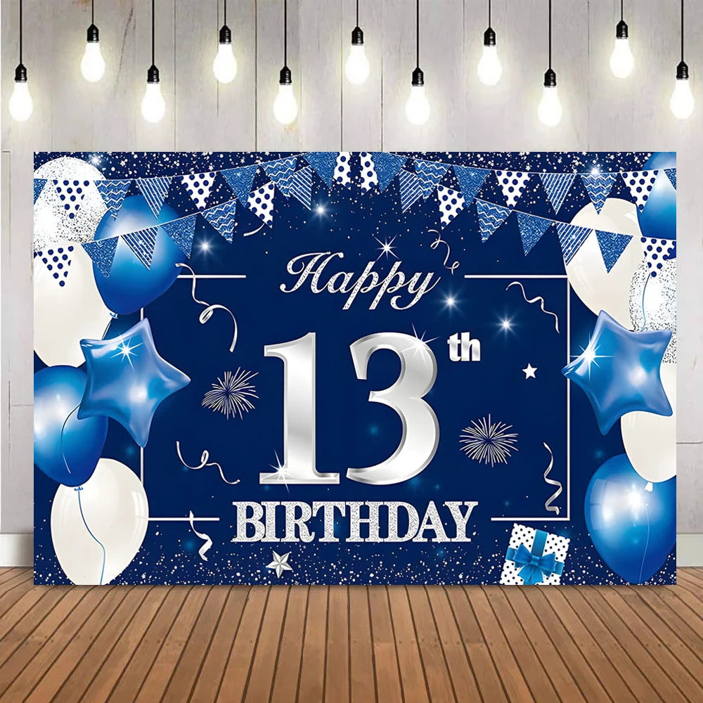 A dark blue party backdrop banner featuring silver text Happy 13th Birthday surrounded by blue and white balloons and bunting