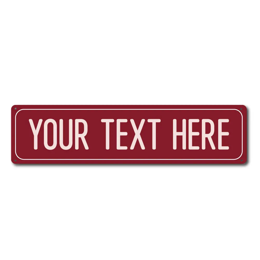 A rectangular red metal street sign with the text YOUR TEXT HERE.