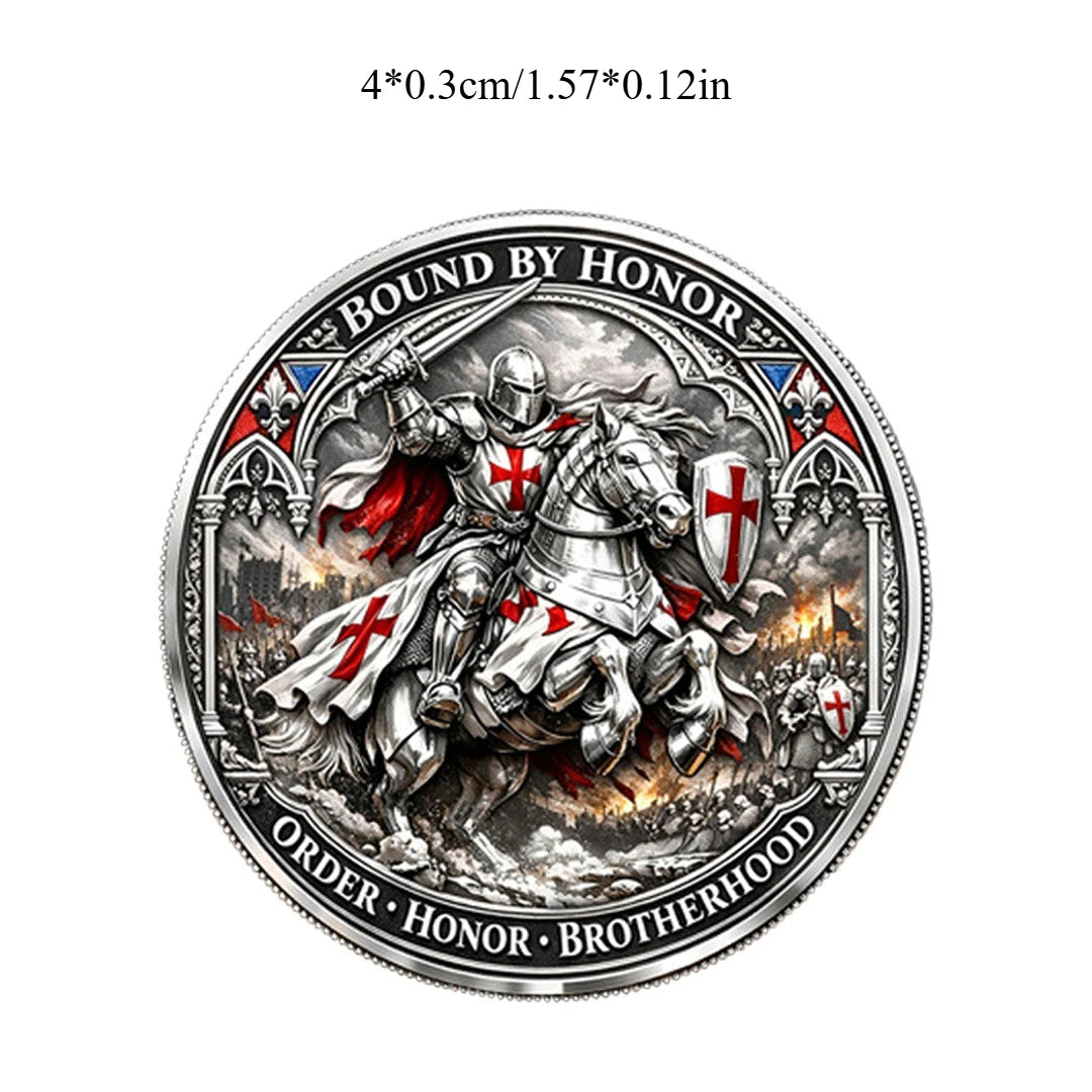 A silver-plated commemorative coin featuring a knight on horseback surrounded by heraldic symbols and text.