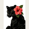A black leopard with a vibrant red hibiscus flower resting on its head.