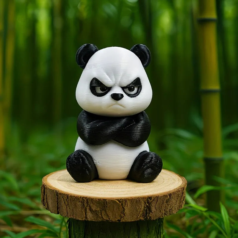 A cute angry panda figurine with black and white fur sitting on a wooden slice in a lush green forest setting.