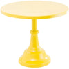 A bright yellow metal cake stand with a round plate and pedestal base.