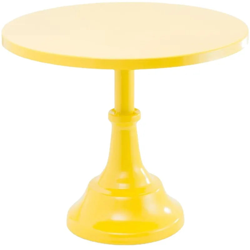 A bright yellow metal cake stand with a round plate and pedestal base.