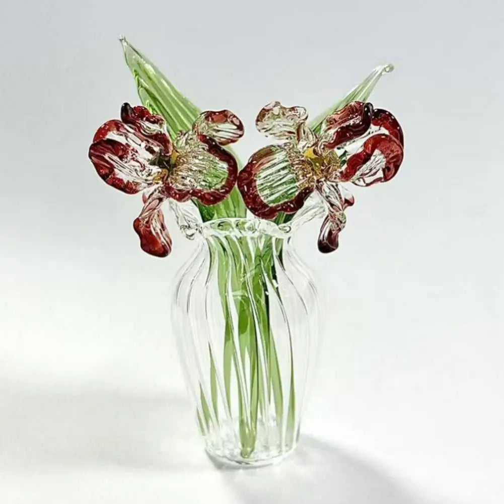 Hand-blown glass flower bouquet featuring deep red and green tulips in a clear glass vase