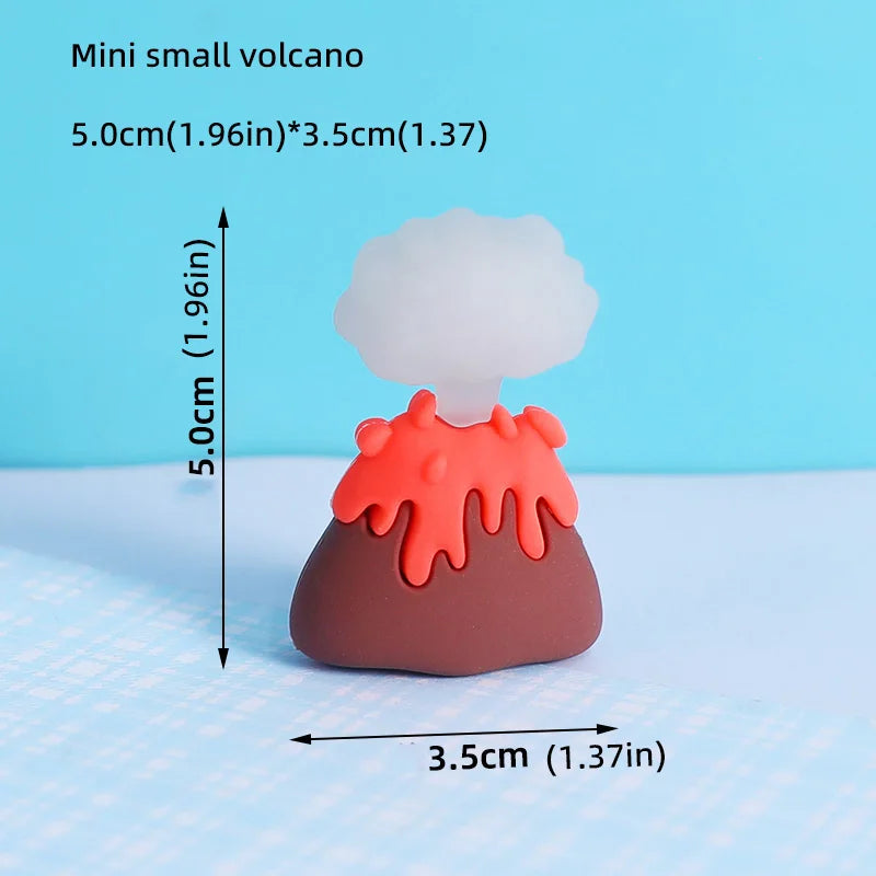 Un pequeño modelo de erupción volcánica naranja y marrón con una nube de humo blanco.