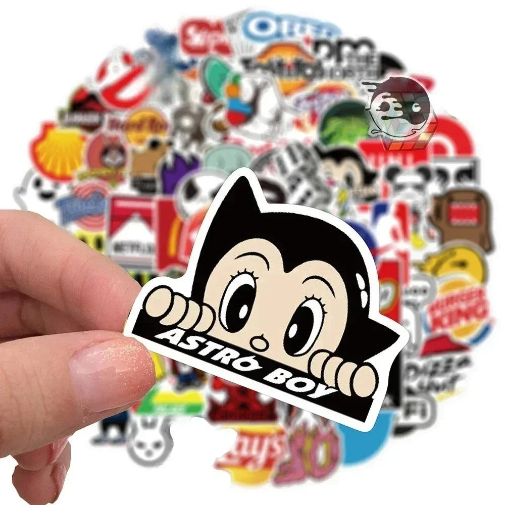 A hand holds a sticker pack featuring an Astro Boy character design.