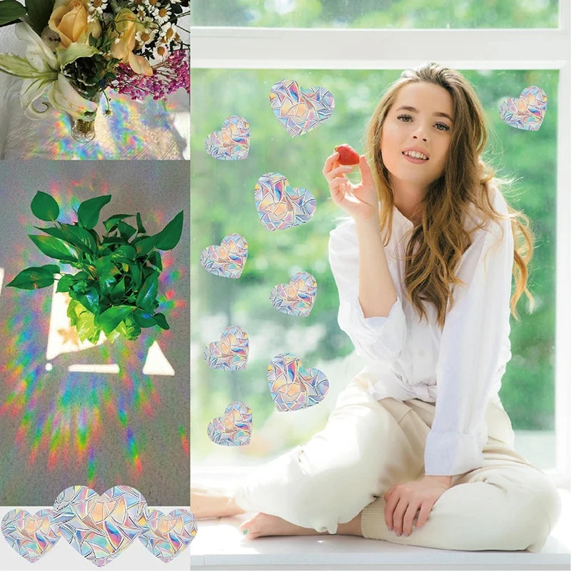 A young woman sits indoors, holding iridescent window stickers featuring cat and butterfly designs.