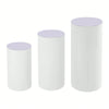 Set of three white cylinder pedestal display stands with light purple tops