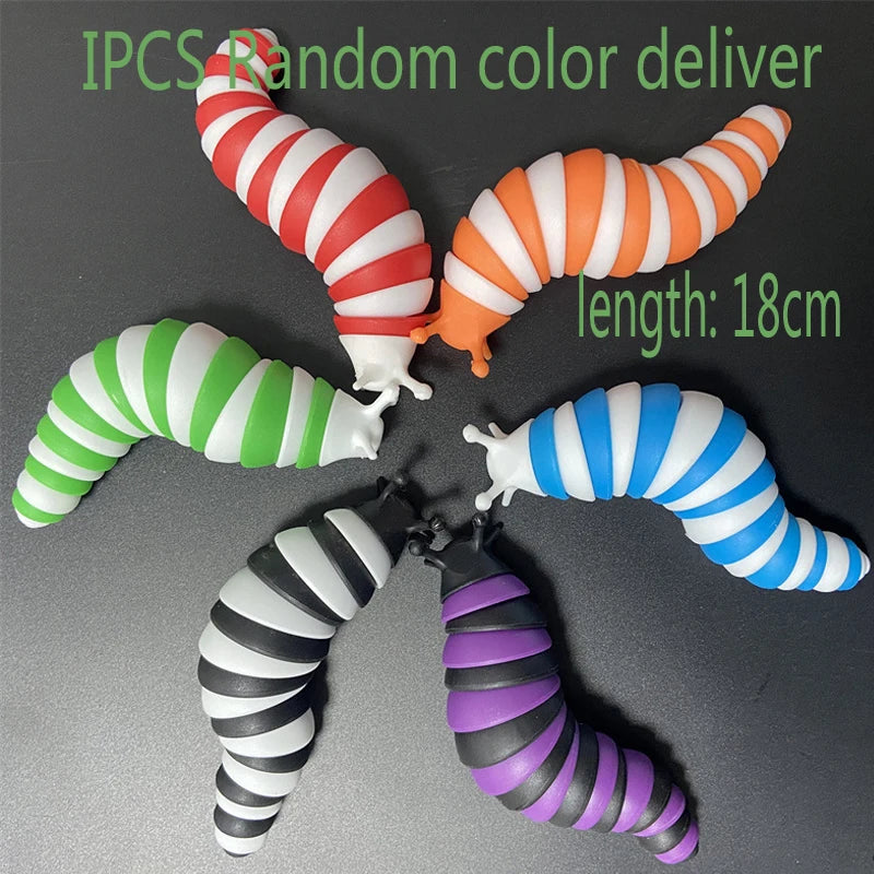Five colorful, striped silicone fidget slug toys of varying colors and lengths are displayed on a dark surface.