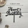 Elegant acrylic birthday cake topper with black lettering and a gold-edged citrus slice.
