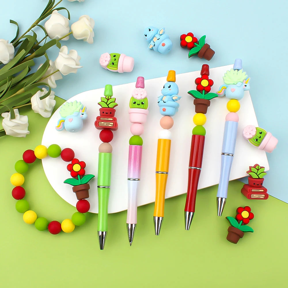 A collection of colorful silicone plant beads and tools for jewelry making and DIY crafts arranged on a light blue background